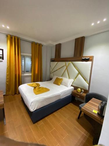 Una cama o camas en una habitación de Hôtel Foham Oasis