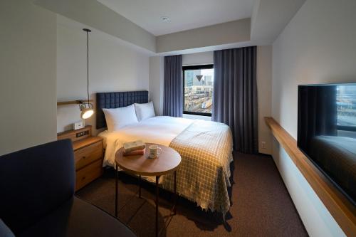 Postel nebo postele na pokoji v ubytování Hotel Resol Stay Akihabara