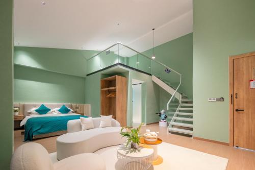 a living room with a bed and a staircase at Huazhu Xiangshan Tongchen Courtyard in Xiangshan