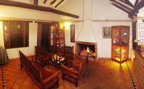 an overhead view of a living room with a fireplace at Hotel Santa Viviana Villa de Leyva in Villa de Leyva