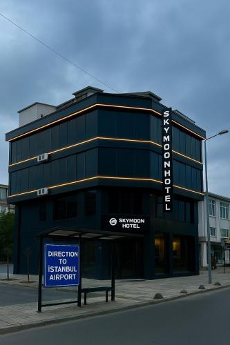 a black building with a sign in front of it at Skymoon Istanbul Airport Hotel in Arnavutköy
