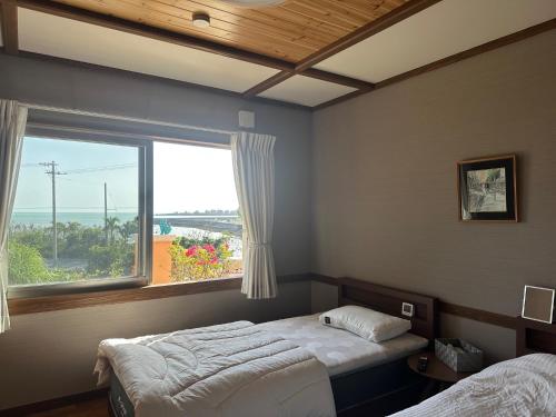 Postel nebo postele na pokoji v ubytování Live Villa 宮古ブルー