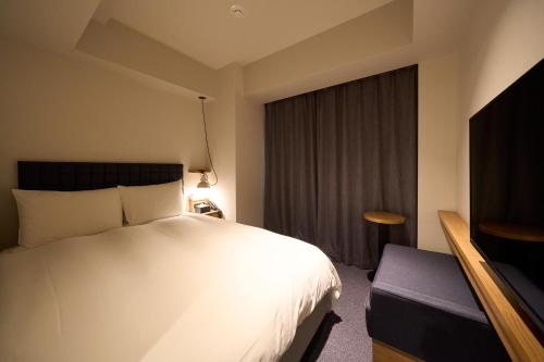 Postel nebo postele na pokoji v ubytování Hotel Resol Stay Akihabara