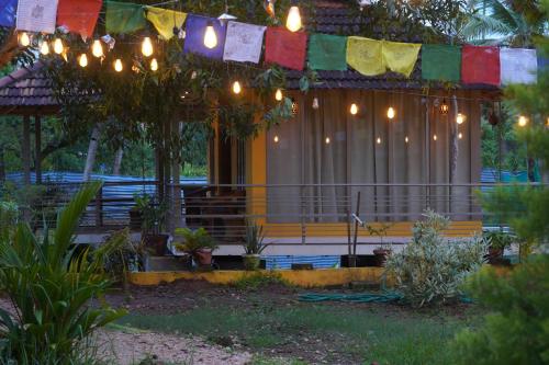 a house with a bunch of lights on it at Vrindavan homestay in Munroe Island