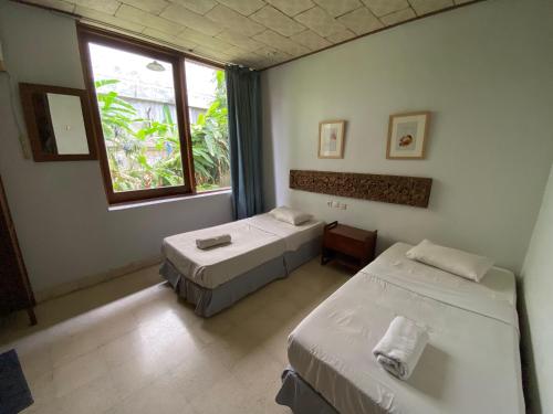 Postel nebo postele na pokoji v ubytování JH Hotel