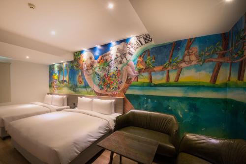 Postel nebo postele na pokoji v ubytování Legend Hotel Kaohsiung Pier2