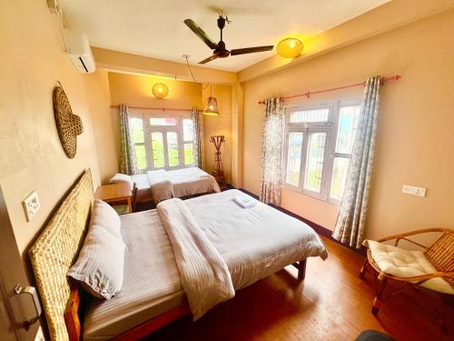 Ένα ή περισσότερα κρεβάτια σε δωμάτιο στο Paris Guest House Airport