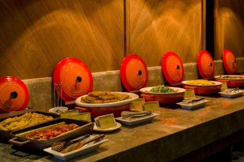 a buffet with many different types of food on a table at Hotel In in Pingzhen
