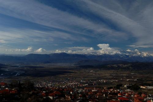 a view of a city with snow capped mountains at Konitsa Mountain Hotel in Konitsa