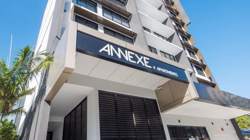 a building with a sign on the front of it at Annexe Apartments in Brisbane