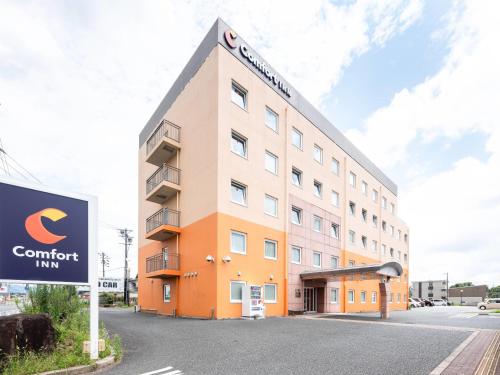 an office building with a sign in front of it at Comfort Inn Toyokawa Inter in Toyokawa