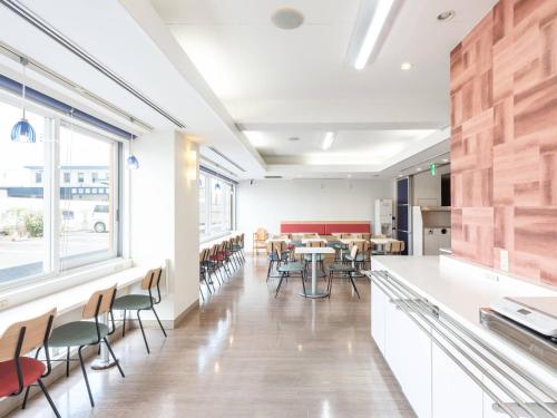 a dining room with a table and chairs at Comfort Inn Toyokawa Inter in Toyokawa