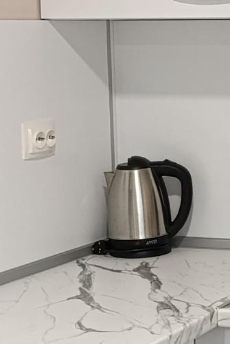 a coffee pot on a counter in a kitchen at Lime House, Kyustendil in Kyustendil
