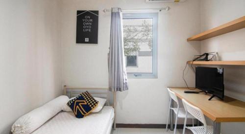 TV a/nebo společenská místnost v ubytování Hotel O Anartha Residence