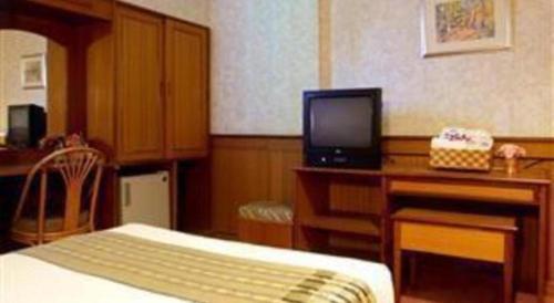 Televiisor ja/või meelelahutuskeskus majutusasutuses Sakol Grand Palace Hotel