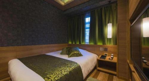 Ένα ή περισσότερα κρεβάτια σε δωμάτιο στο Hotel Ann Tsukiji