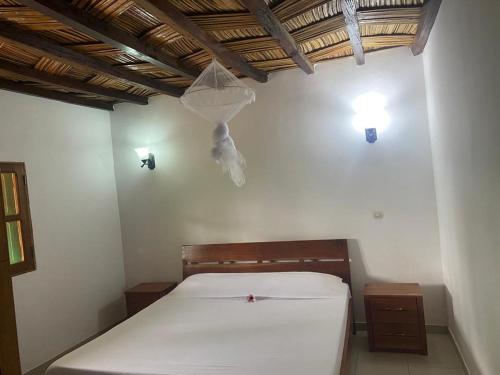 Ένα ή περισσότερα κρεβάτια σε δωμάτιο στο Maison Diamota