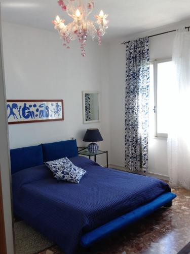 Ένα ή περισσότερα κρεβάτια σε δωμάτιο στο Casa Sulla Laguna