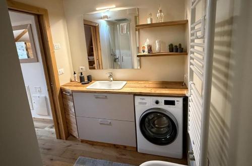 Køkken eller tekøkken på Pragma Apartments - Wood Lodge Predazzo