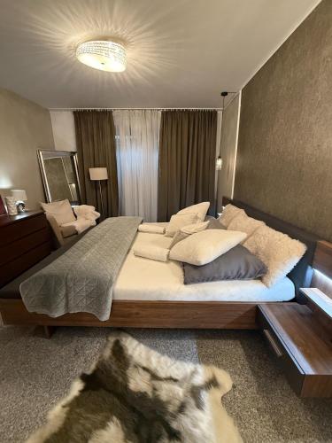 a bedroom with a large bed in a room at Koliba 222 in Bratislava