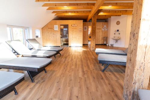 a room with a bunch of beds in it at Gulfhof Fresena in Norden