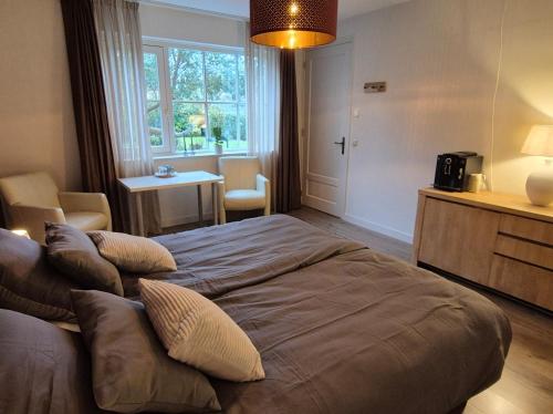 En eller flere senge i et værelse på Villa Bergstein