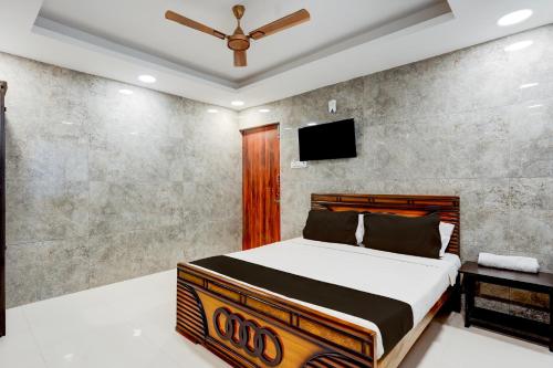 Ένα ή περισσότερα κρεβάτια σε δωμάτιο στο Collection O Karumariamman Temple Thiruverkadu Formerly Sridevi Residency