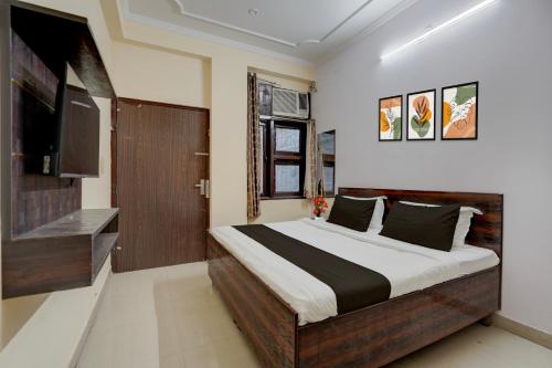 Ένα ή περισσότερα κρεβάτια σε δωμάτιο στο Hotel O Jagatpura Central Railway Station Jaipur