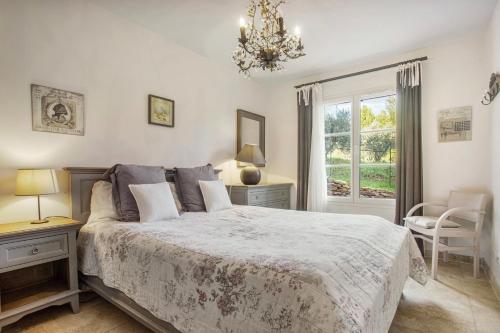 Postel nebo postele na pokoji v ubytování Le Mûrier