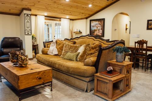a living room with a couch and a table at Escape to Villa Serena in Dahlonega