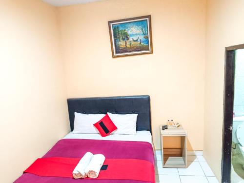 Una cama o camas en una habitación de The Legian 777