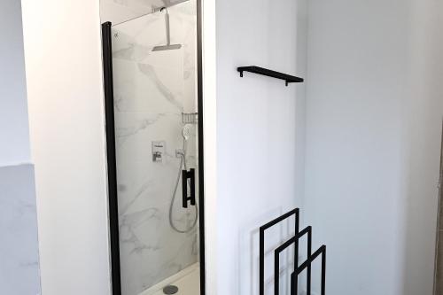 Et badeværelse på Filori - T2 avec piscine chauffée et plage privée