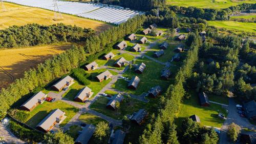 an aerial view of a village with houses and trees at Landal Piperdam in Dundee