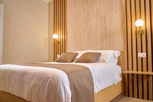 Ένα ή περισσότερα κρεβάτια σε δωμάτιο στο Guest House Aura - Lumys Fiumicino