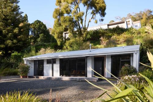 a house on the side of a hill at Minden Retreat in Te Puna