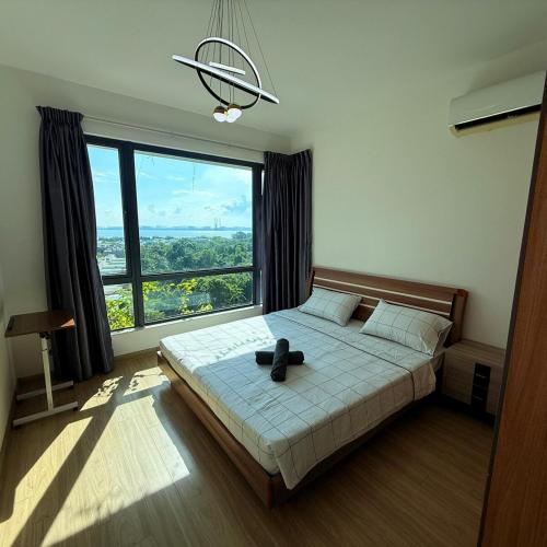 Ένα ή περισσότερα κρεβάτια σε δωμάτιο στο Regalia Park Block B Sea View 2B2R 6 Pax