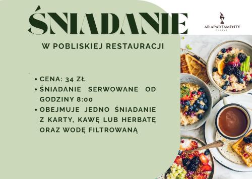 Un volante para un restaurante con tazones de comida. en AR Apartamenty, en Poznan