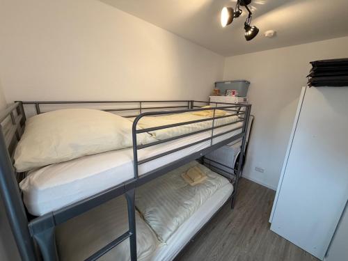 a bedroom with two bunk beds in a room at Berghütte Astenpanorama in Winterberg