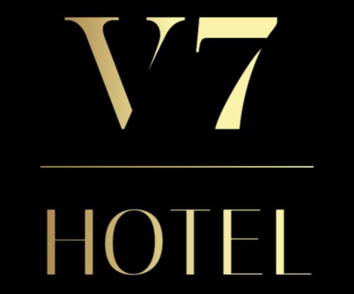 Un cartel amarillo con la palabra hiril. en Hotel V7, en Milán