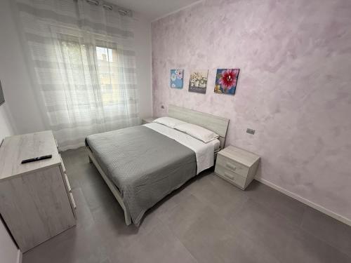 Voodi või voodid majutusasutuse Appartamenti Rugacesio 24 - C toas