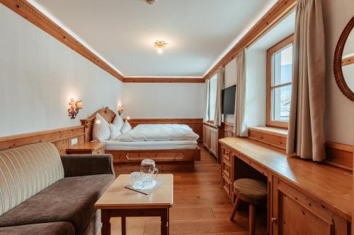 Ένα ή περισσότερα κρεβάτια σε δωμάτιο στο Biohotel Schweitzer