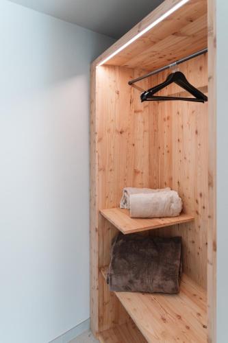 a room with wooden walls and wooden shelves at Agritur Lawanda in Vezzano