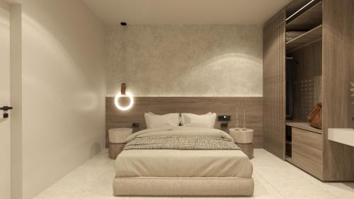 a bedroom with a large bed in a room at Nysa Luxury villa 3 in Anissaras