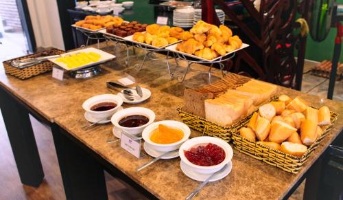 a table topped with lots of different types of food at TTC Hotel - Hoi An in Hoi An