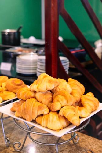 a bunch of loaves of bread sitting on a tray at TTC Hotel - Hoi An in Hoi An