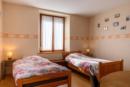 Postel nebo postele na pokoji v ubytování Le Gîte À Mamie