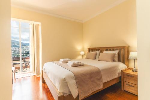 Postel nebo postele na pokoji v ubytování Santo Antonio View by Atlantic Holiday