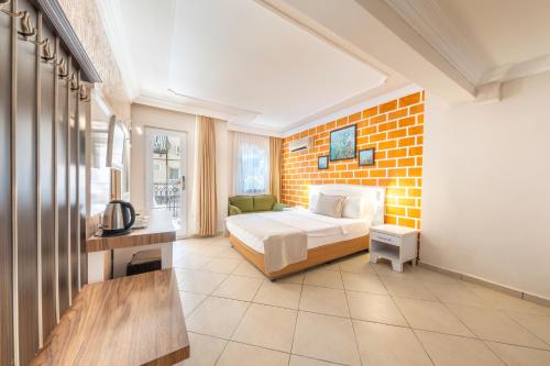 Postel nebo postele na pokoji v ubytování Nicholas Park Hotel