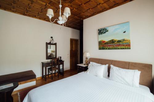 Ένα ή περισσότερα κρεβάτια σε δωμάτιο στο Αρχοντικό Ναουμίδη