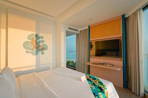 a bedroom with a bed with a fish on the wall at h78 Guraidhoo in Guraidhoo